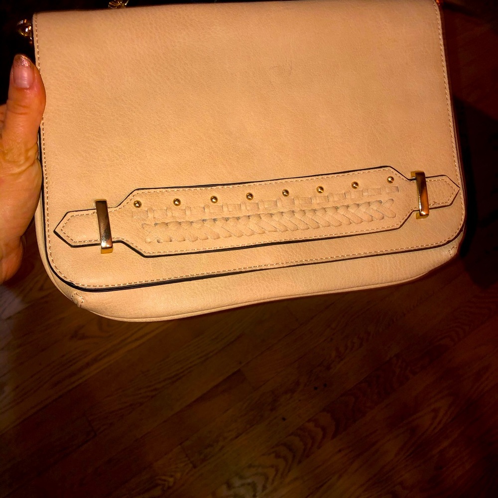 Brand new, never worn, cross body clutch. Suede. Beige. Original price was $72.